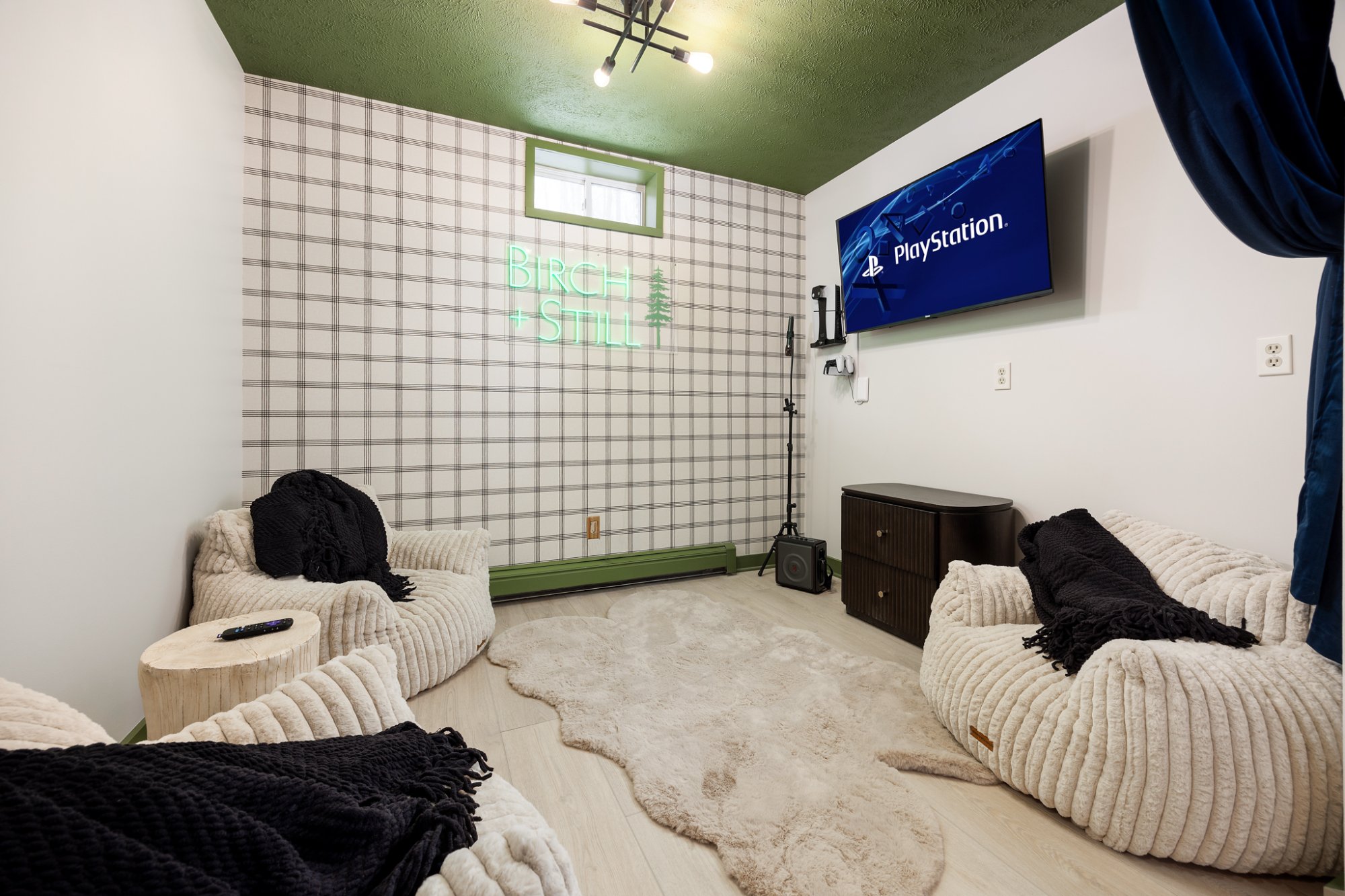 PS5 lounge with neon sign