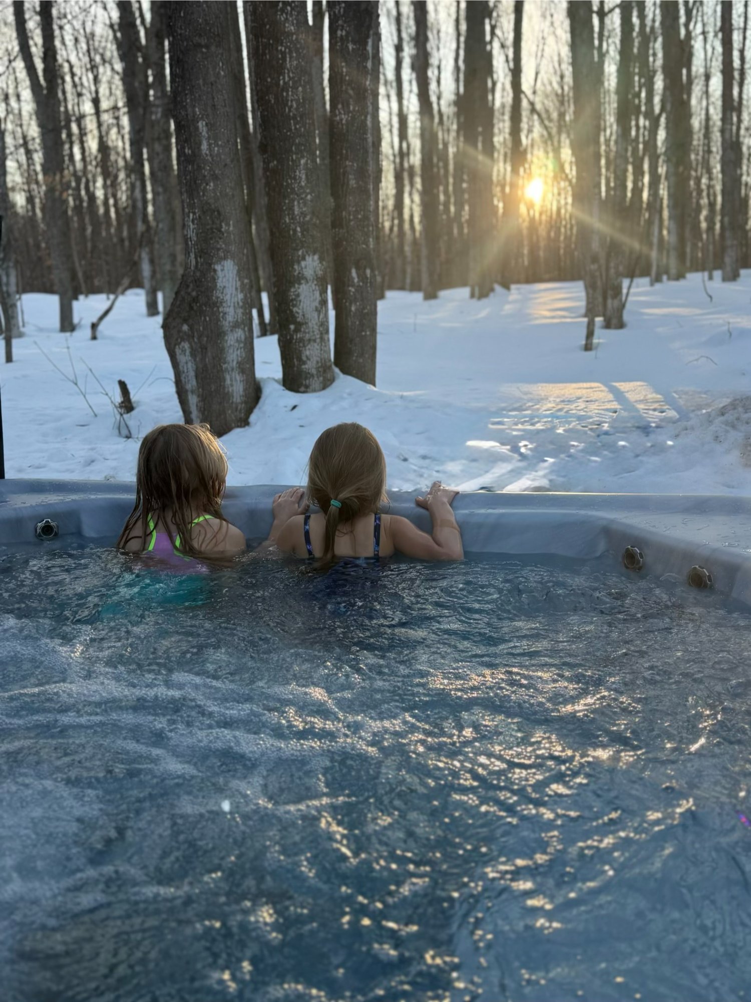 Kids in hot tub at sunset