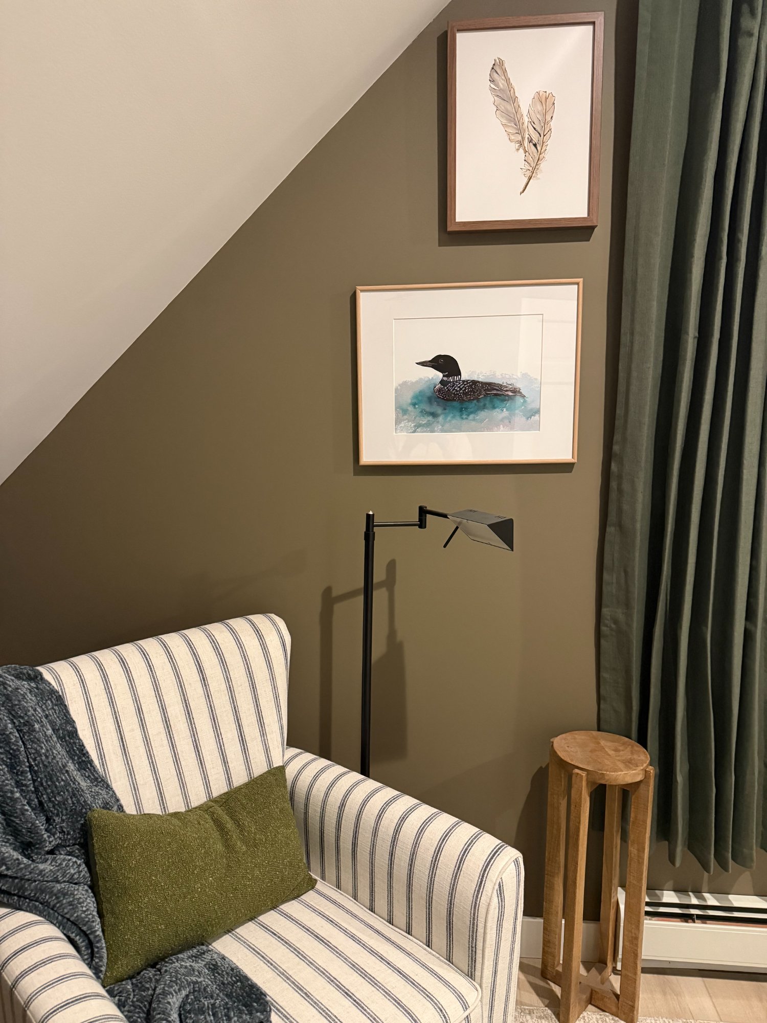 Loon painting and striped chair