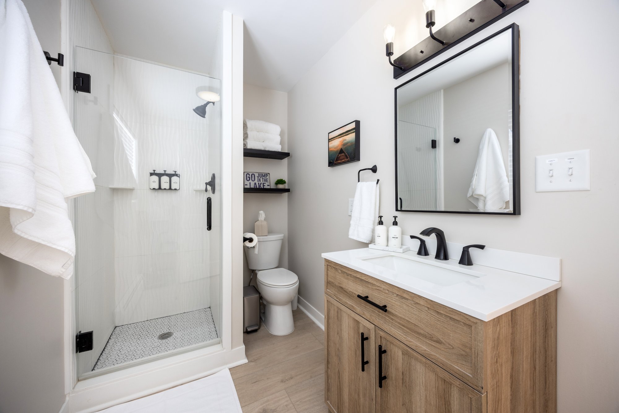 Wood vanity with walk-in shower