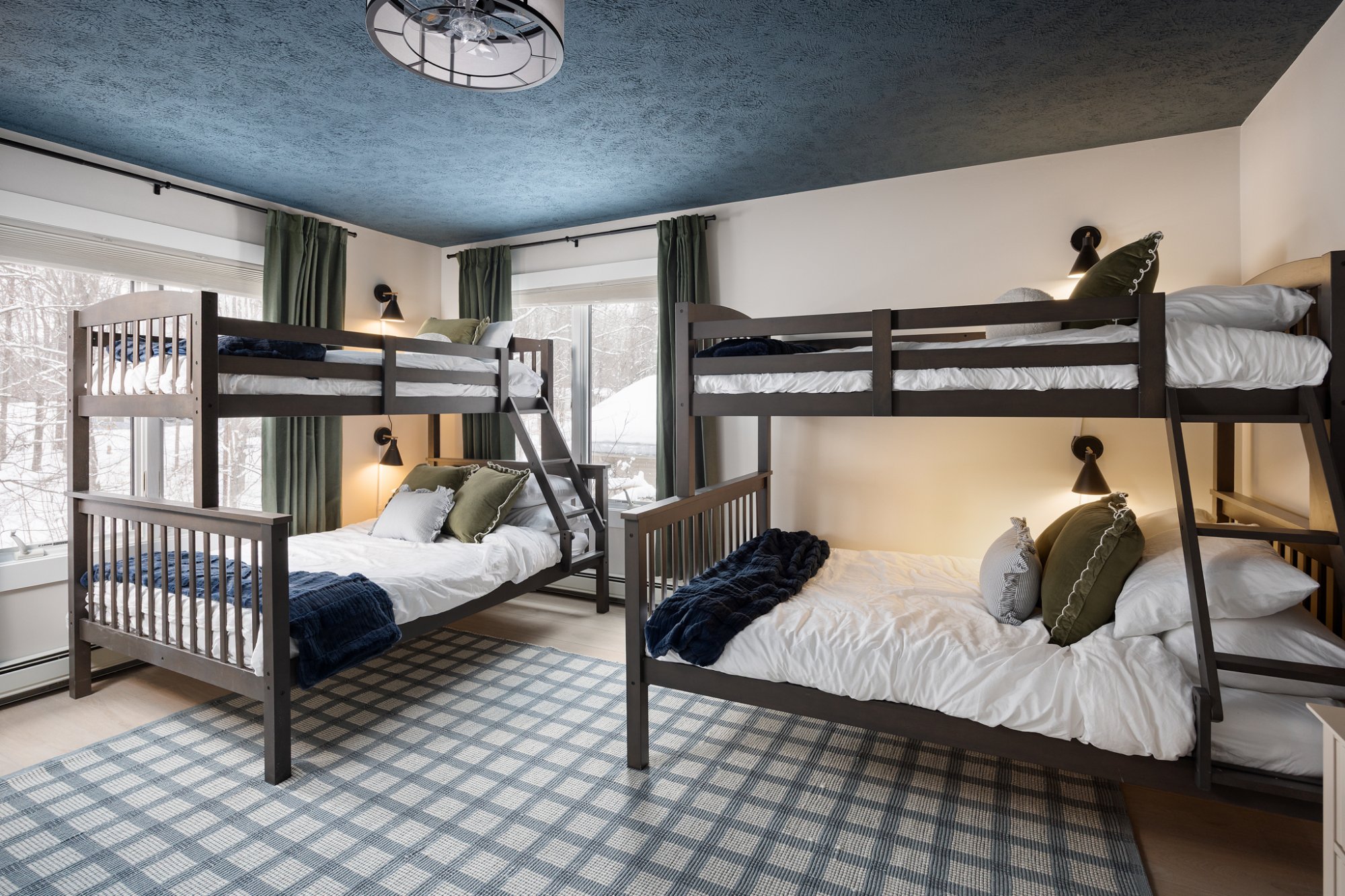 Bunk room with blue ceiling