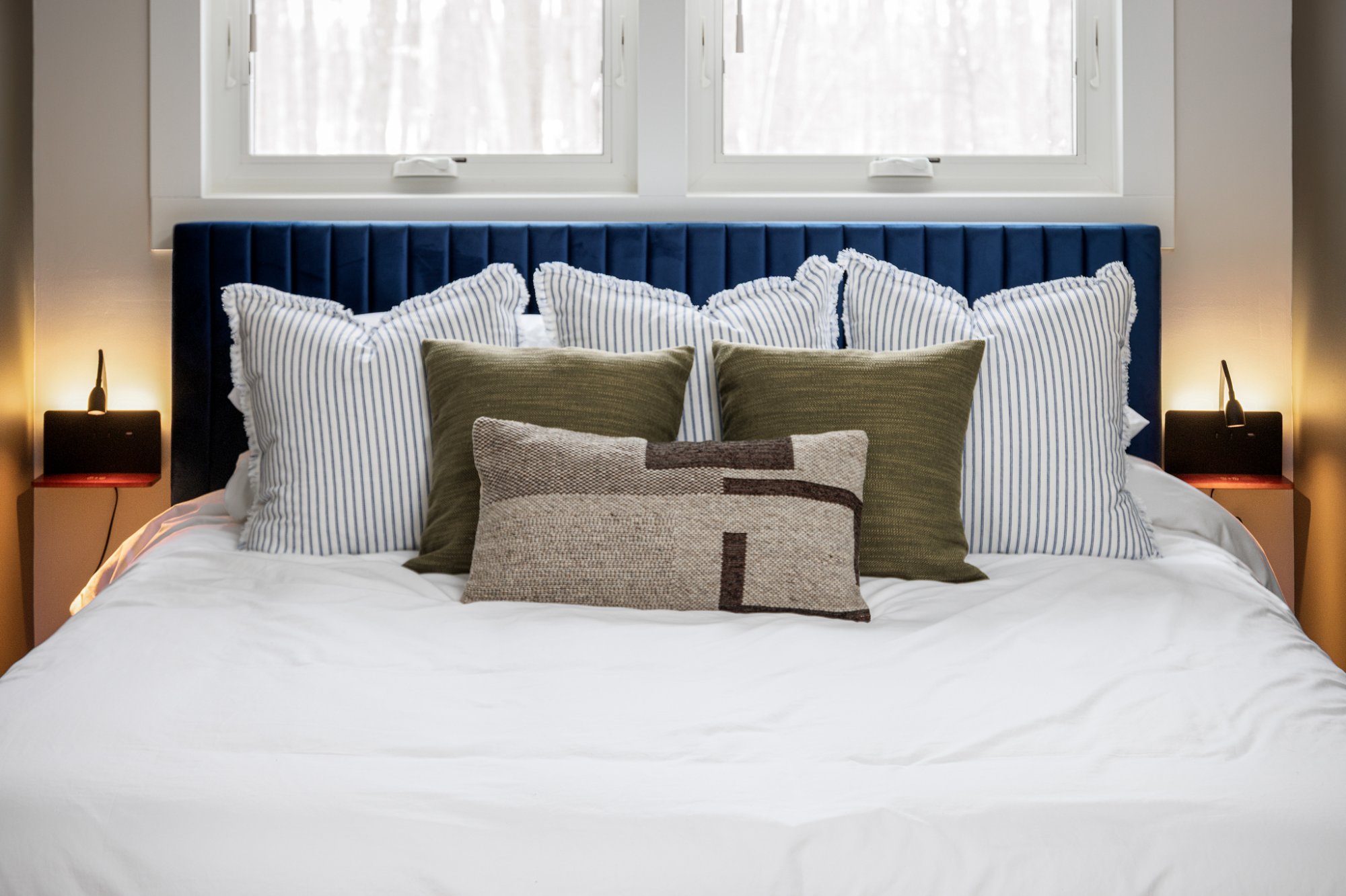 Blue headboard with pillows