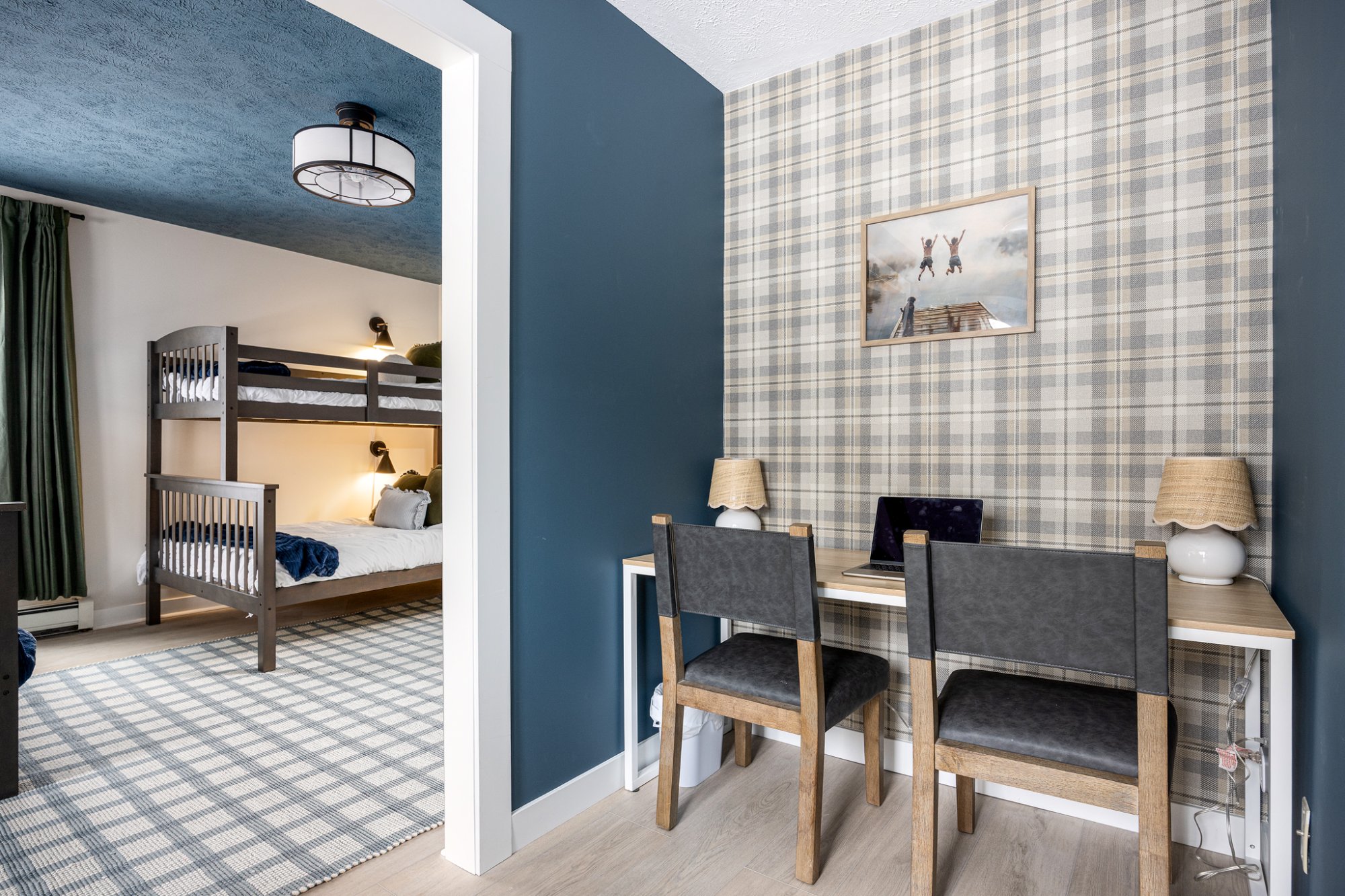 Plaid desk area with bunk room view